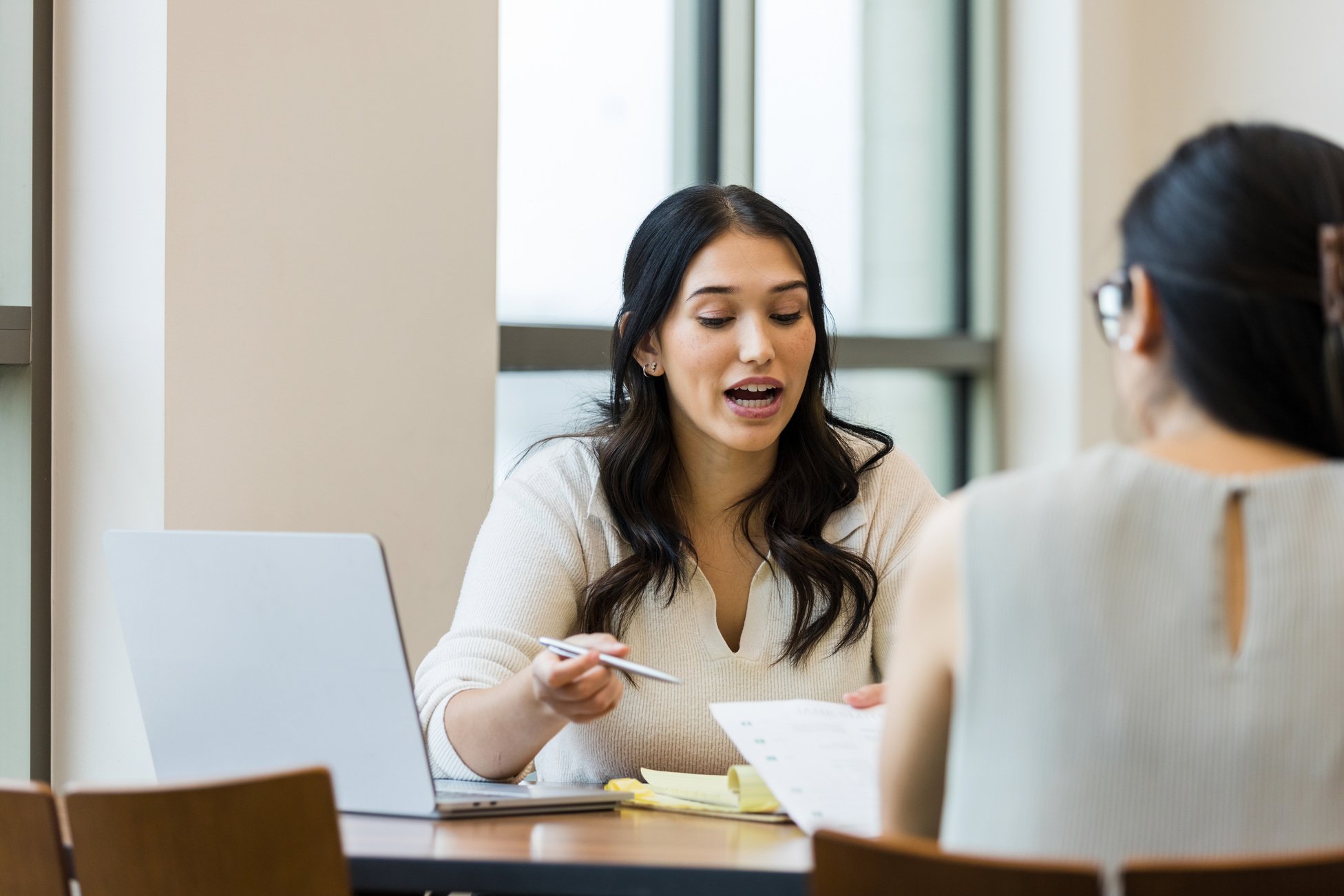 Human resources manager talks with employee